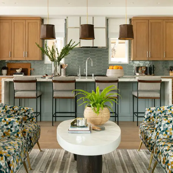 Blue and wood coastal kitchen with leather pendants.