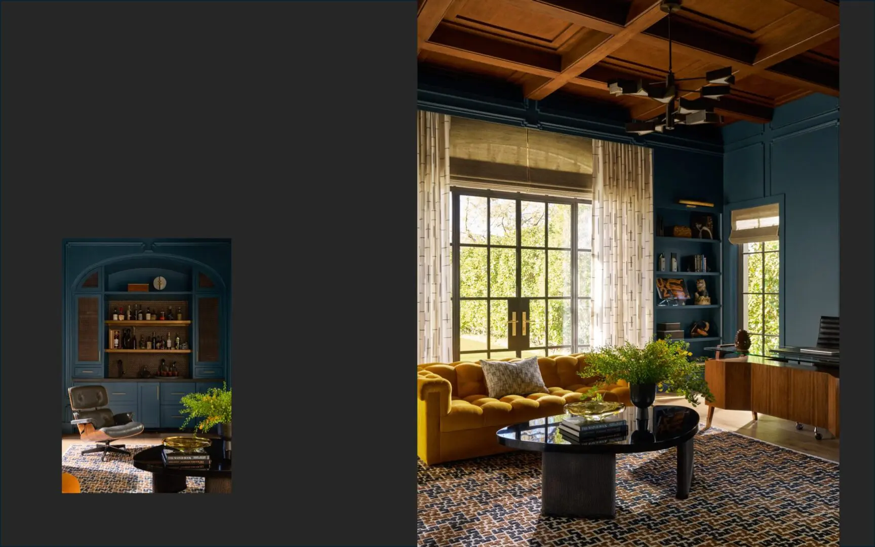A moody office with blue walls, wood ceiling, mustard yellow velvet tufted sofa, and Eames chair.