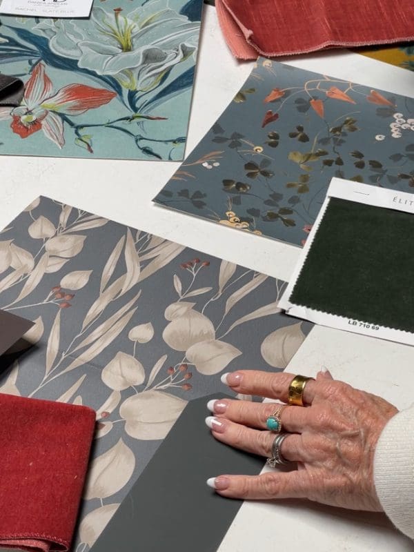blackband-design-vibrant-eclectic-luxury-materials Colorful wallpaper and fabric samples on a white table.