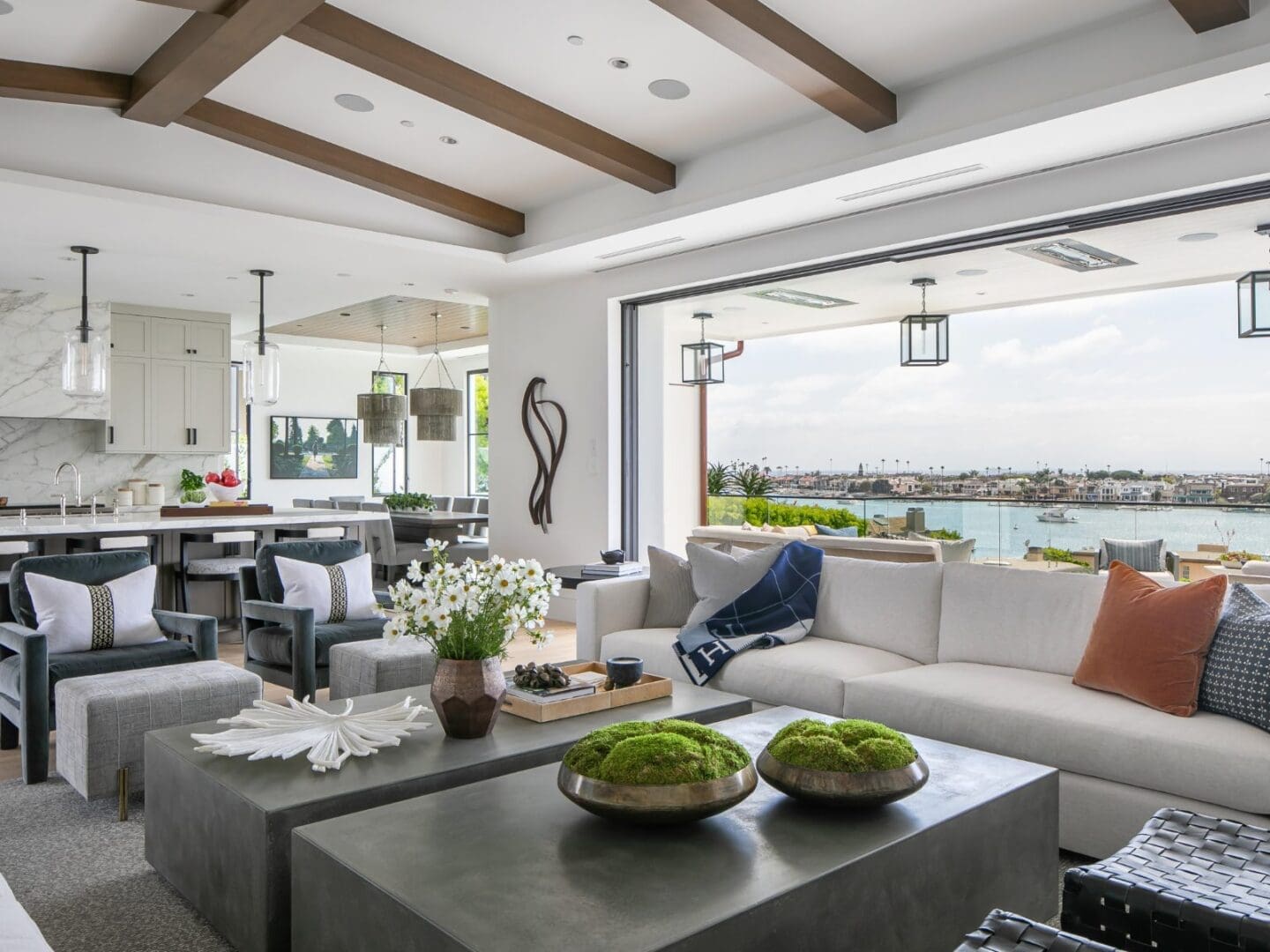 Luxury living room with doors open to the Newport Harbor.