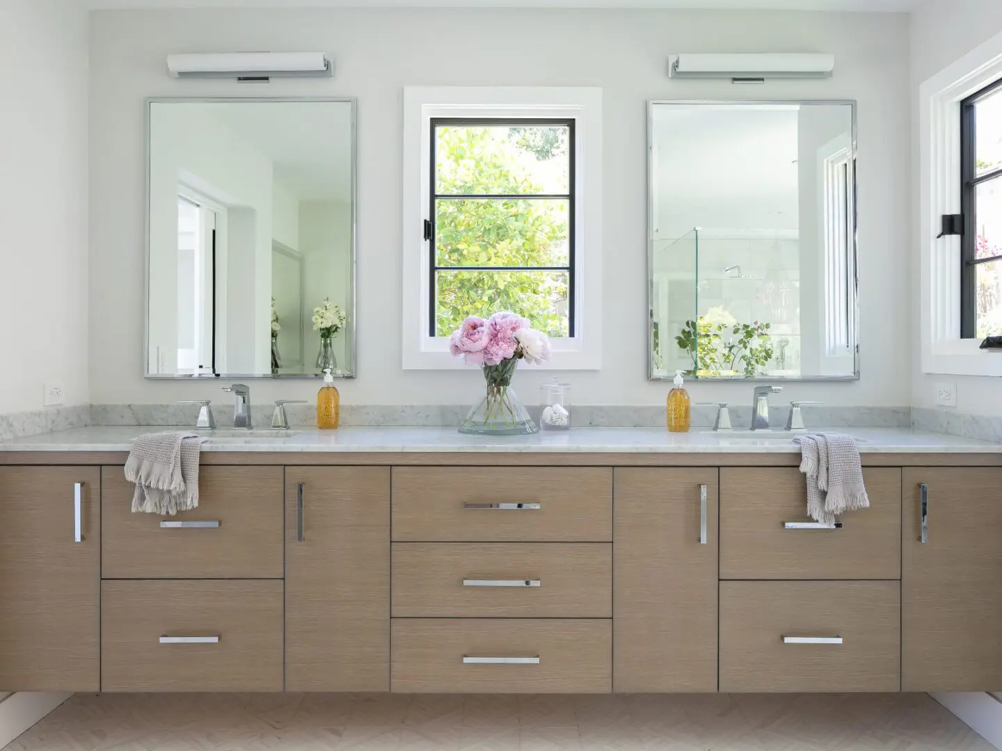 Primary bathroom with natural wood double vanity.