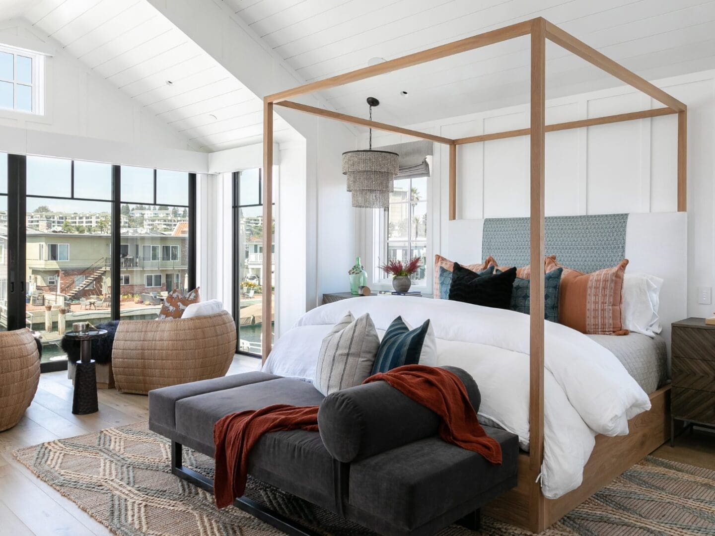 Canopy bed in a coastal bedroom in Newport Beach.