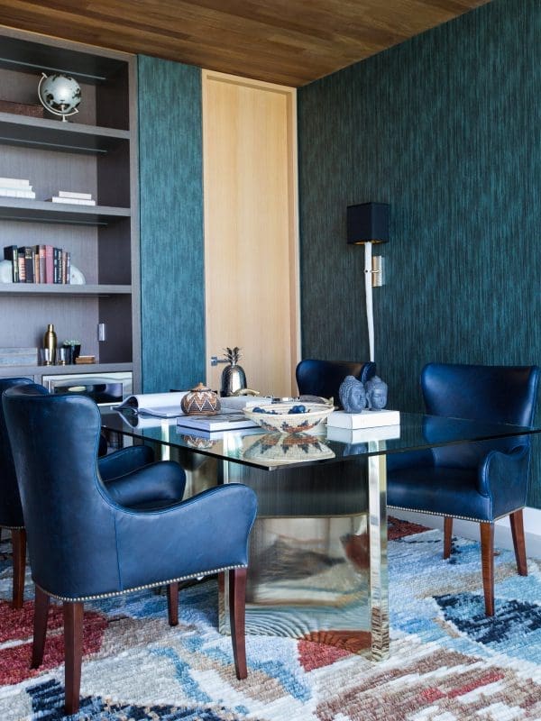 blackband-design-bel-air-contemporary-office Home office with teal wallpaper and navy blue leather chairs.