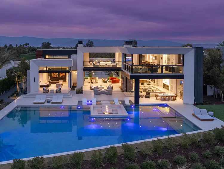 ec9859df87c67154926681a3d21de10d-uncropped_scaled_within_1536_1152-C Modern luxury home with pool at dusk.