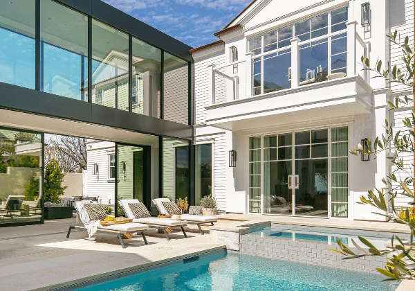 Blackband-Design-Blog-Outdoor-Living-Inspiration Modern home with glass breezeway and pool.