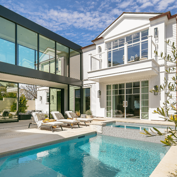 Modern home with glass breezeway and pool.