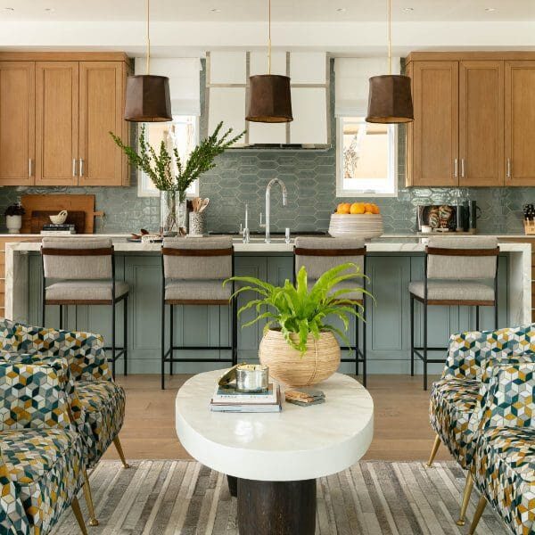 Blue and wood coastal kitchen with leather pendants.